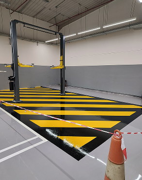 Commercial epoxy flooring installation by Zareeq Coating