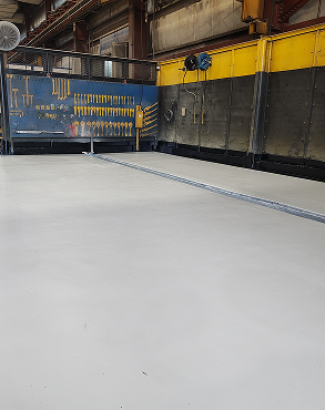 Seamless industrial flooring with chemical-resistant coating